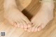 A woman's feet on a wooden floor. 